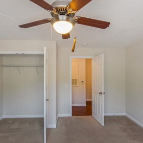 room with a closet and access to the bathroom