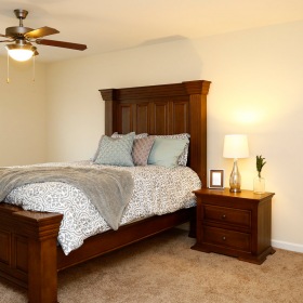 Bedroom Large bedroom with natural lighting and ceiling fans